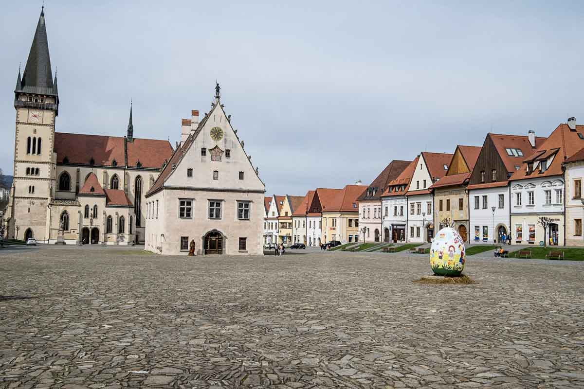 cobbled main square in bardejov in slovakia with pretty gabled houses and basilica