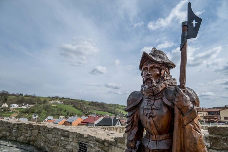 sculpture of a soldeir with a spear next to wall in bardejov slovakia