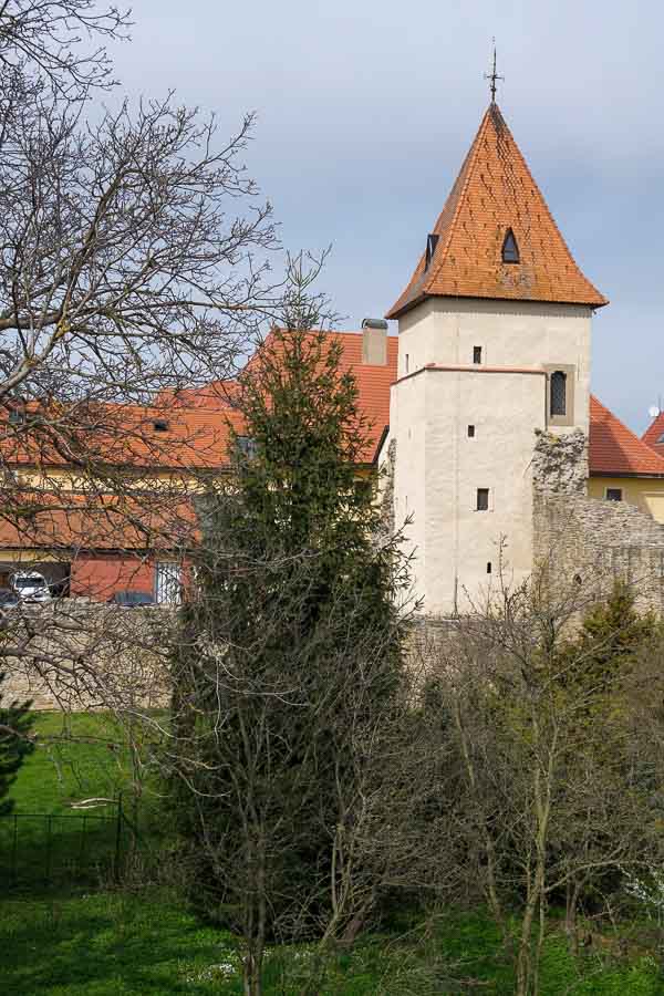 one of the defensive towers with a red tile roof along bardejov city walls