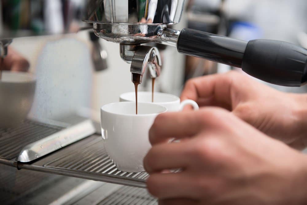 barista making coffee