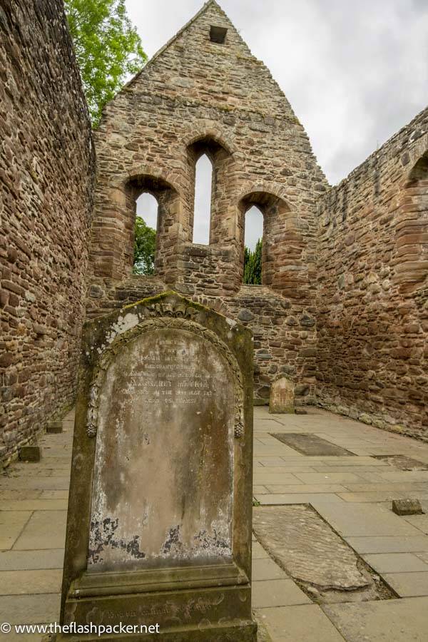 tombstone in the middle of a ruined chapel of beauly priory Scotland