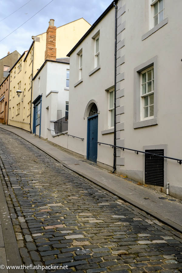 row of cream and yellow houses