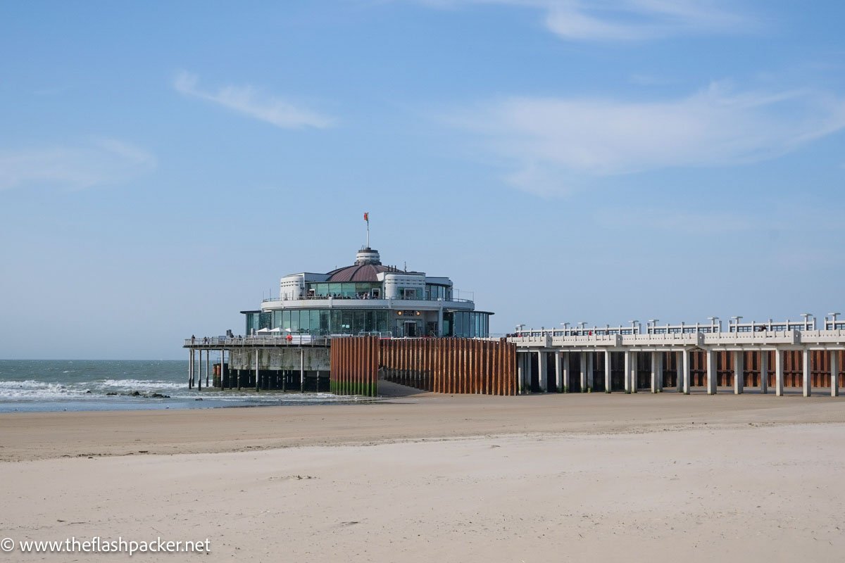 circular building on the end of a pier at blankenberge beach in belgium