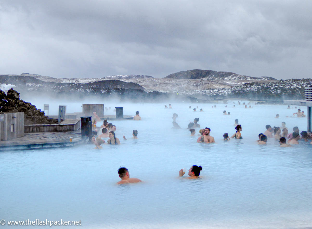 people bathing in milky water but is the blue lagoon worth it