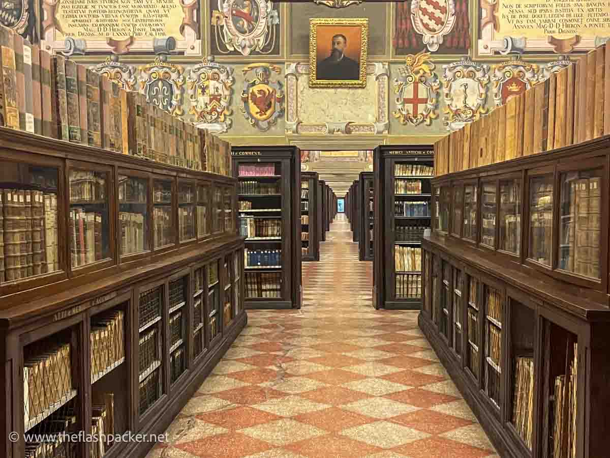 a series of rooms with wooden shelves of old books