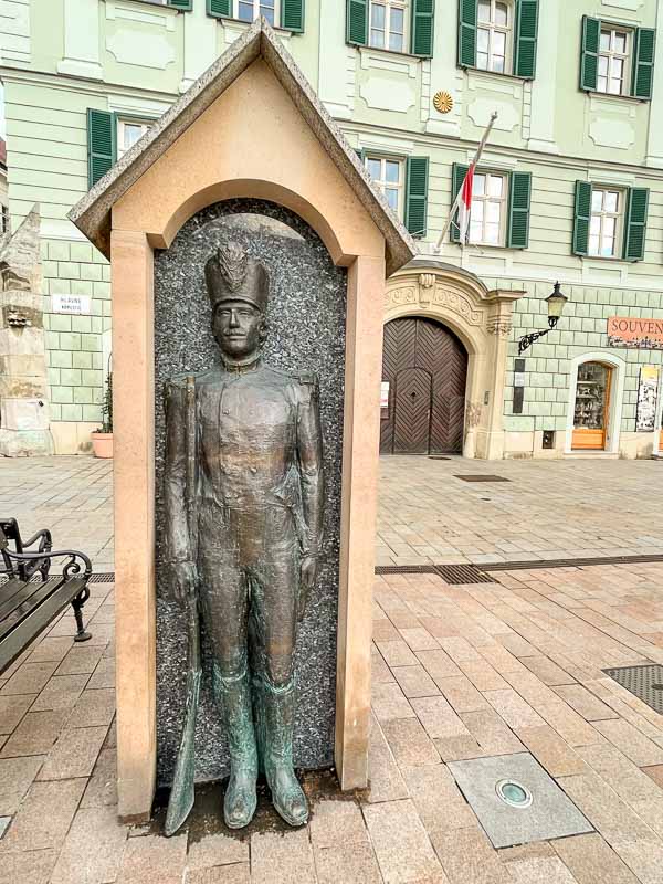 bronze sculpture of a sentry in a box