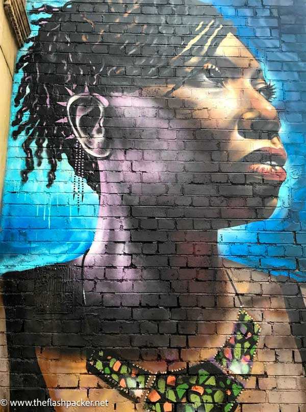 brick-lane-street-art-by-dreph of woman wearing brightly coloured african necklace