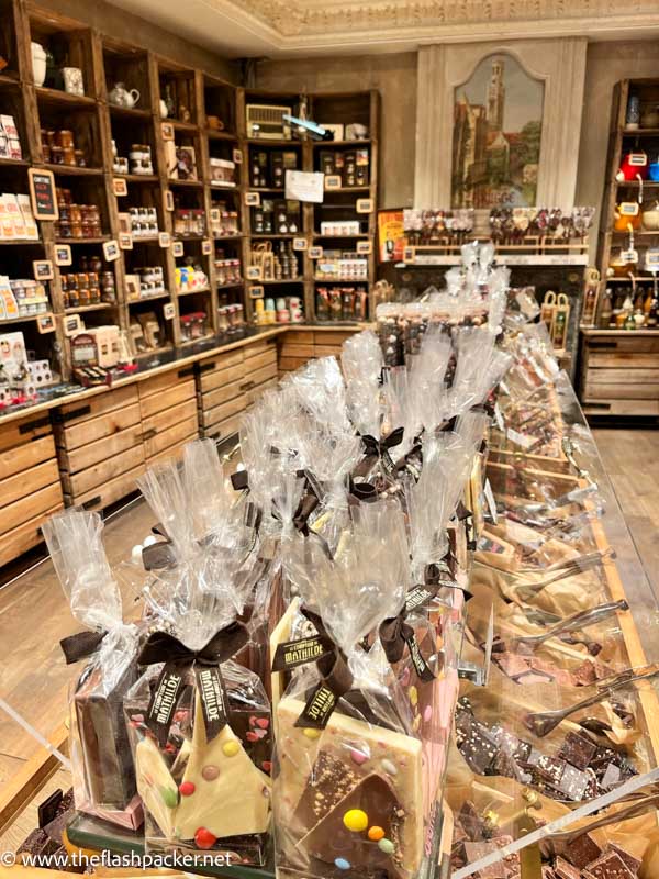 chocolate shop with central display of artisan slabs wrapped in cellophane