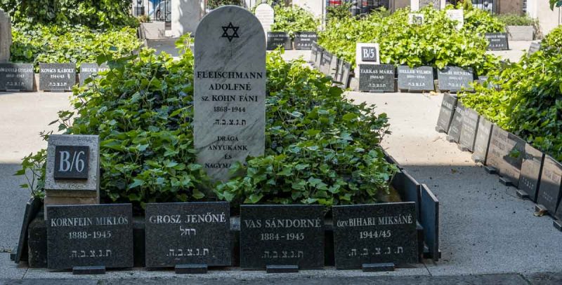 grey jewish gravestones in a courtyard