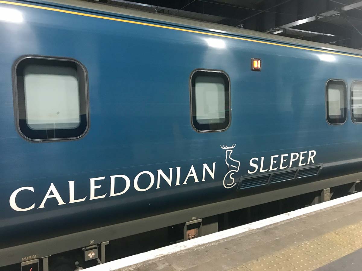 blue exterior of carriage of train considered in caledonian sleeper first class review