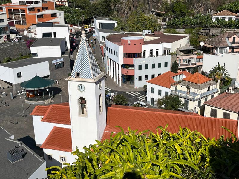 aerial view of a church in the middel if a small town