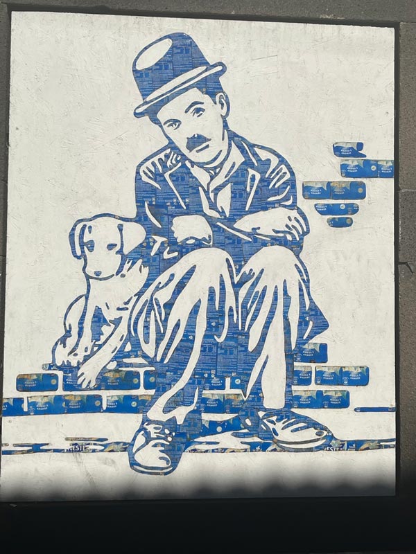 street art of cahrlie chaplin and dog