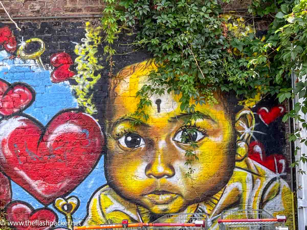 wall mural of an african child and love hearts