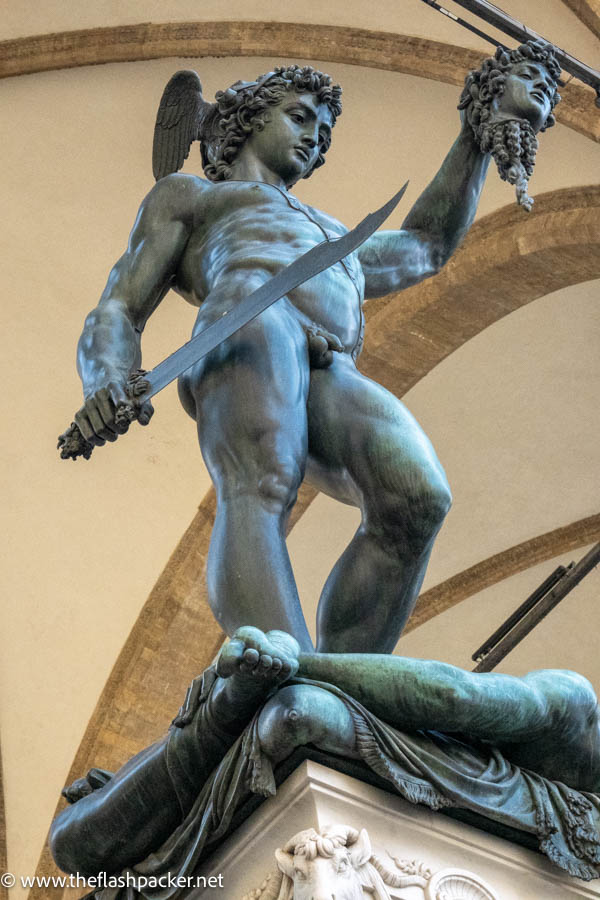 bronze statue of perseus holding a decapitated head