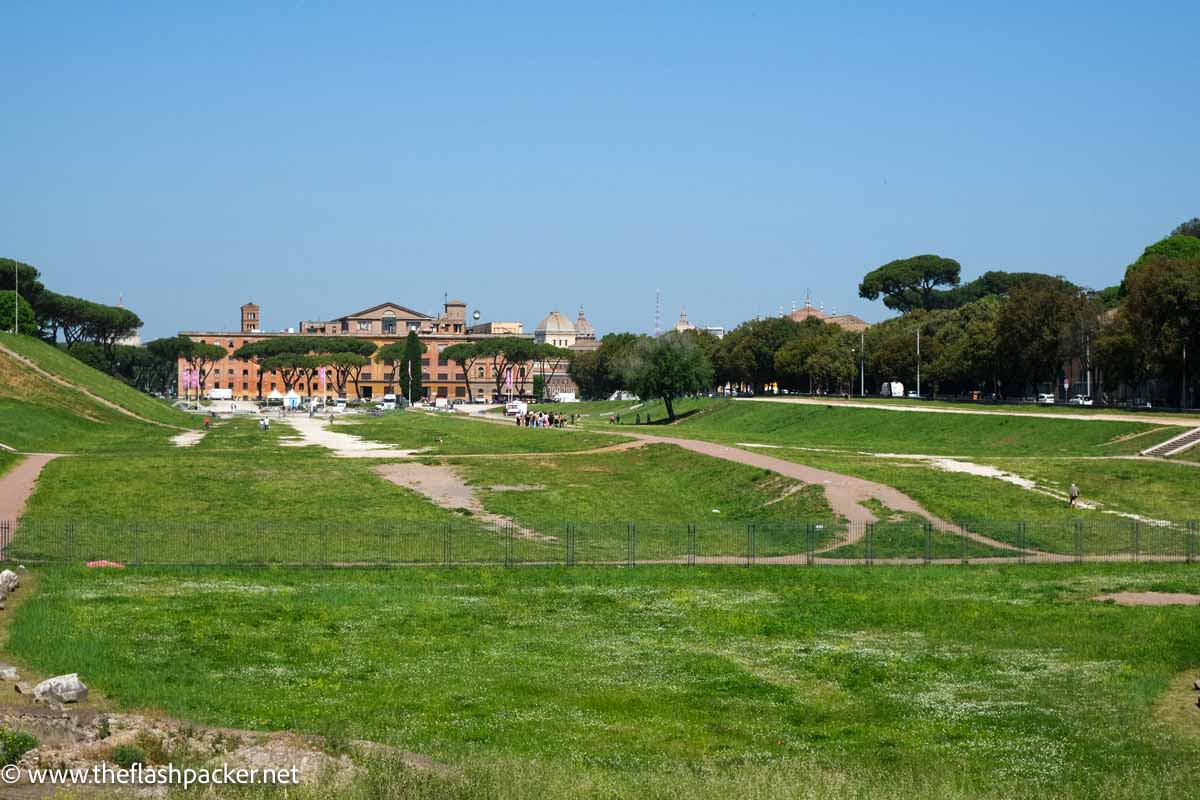 oblong grassy field of circus maximus in rome