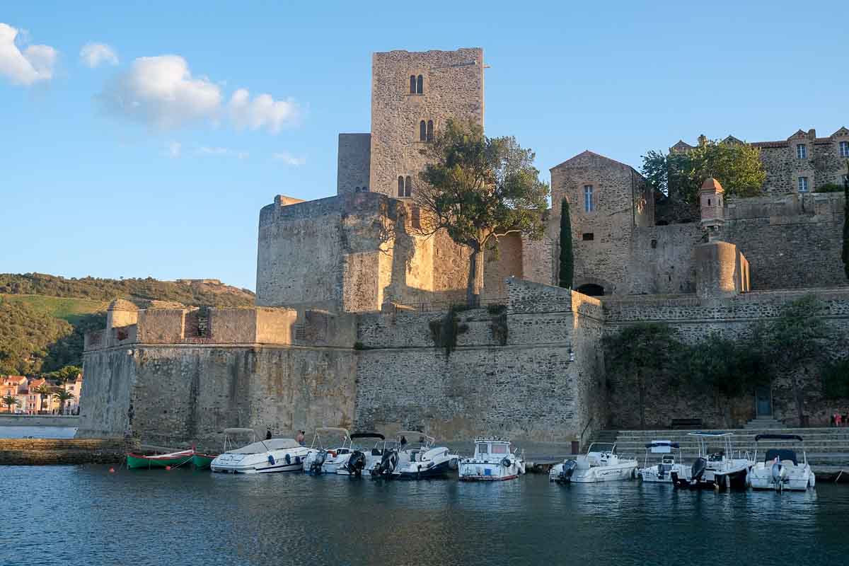 old stone castle of collioure by the side of a harbous