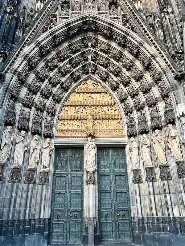 portal of cologne cathedral germany with intricately carved statues