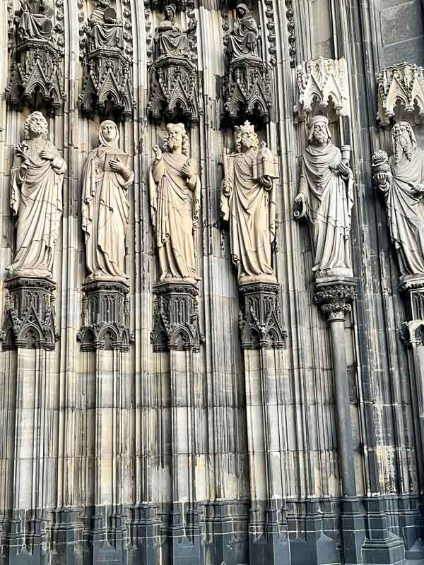 carved stone figures at portal of cologne cathedral