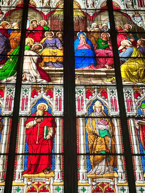 brightly coloured stained glass window in cologne cathedral