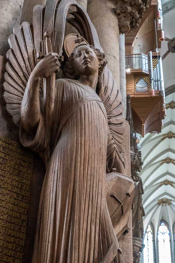 statue of saint on nave of cologne cathedral