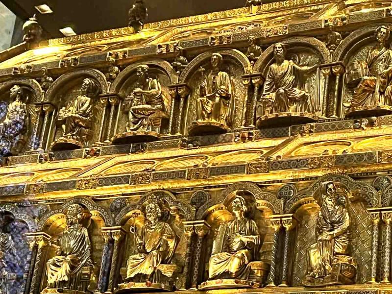 gilt encased shrine with carved figurines