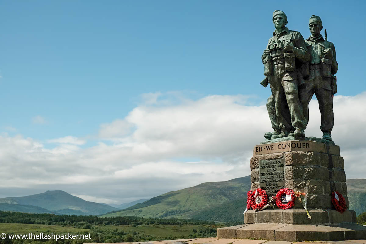 memorial statue with mountains in background