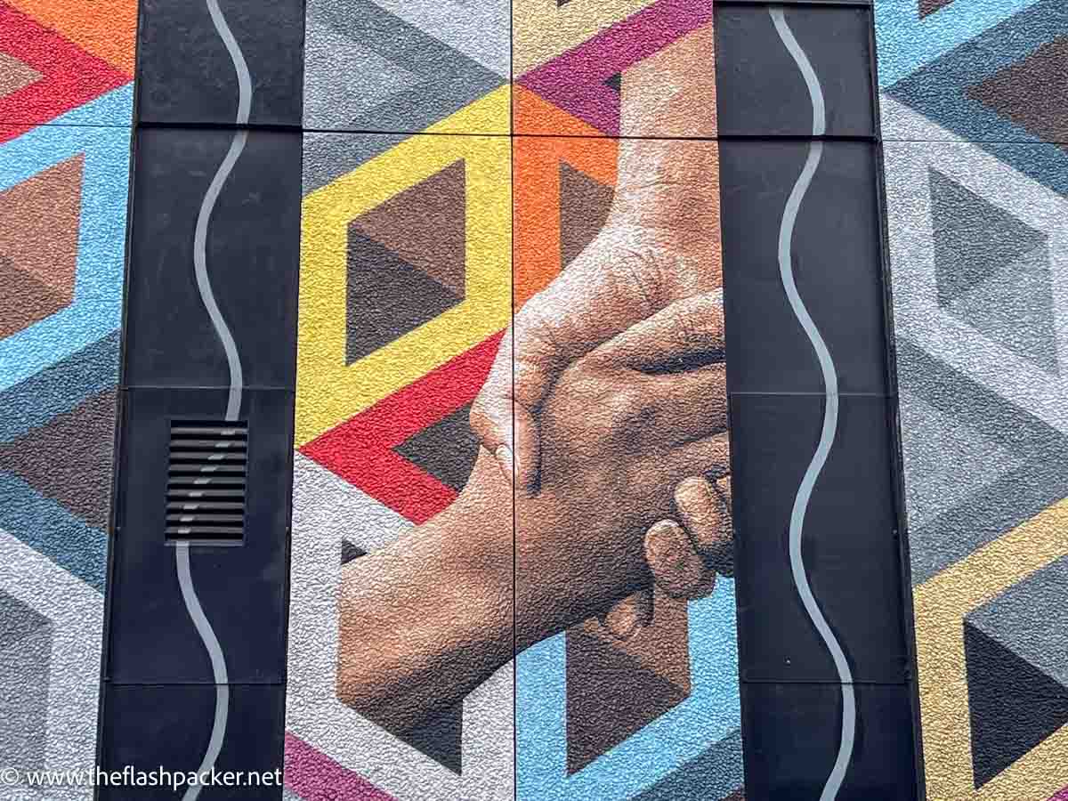 wall mural of two hands clasped together