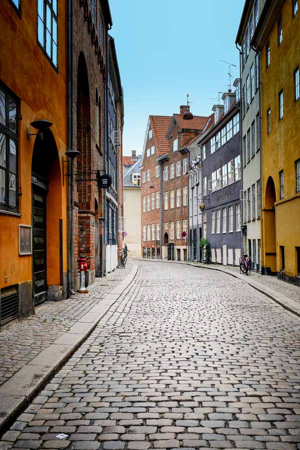 cobblestoned street with brightly coloured buildings