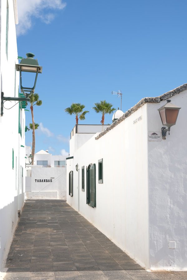 whitewashed buidlings along a narrow lane