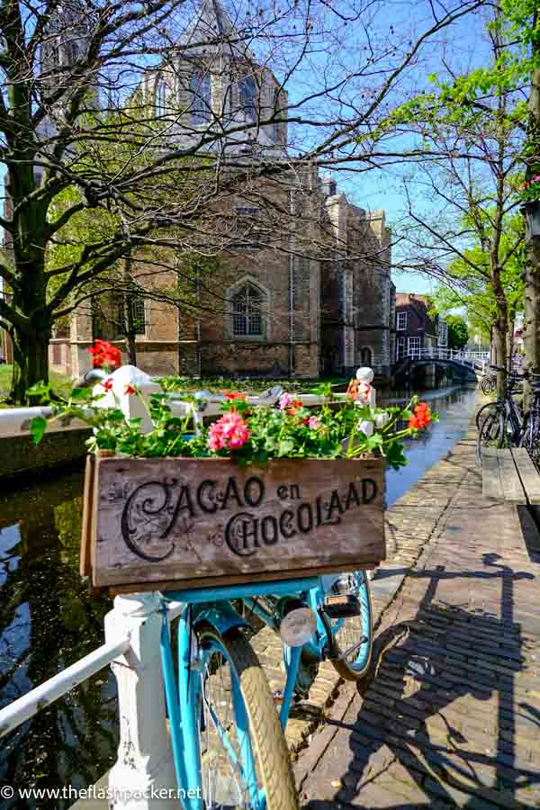 bicycle with flowers by side of canal