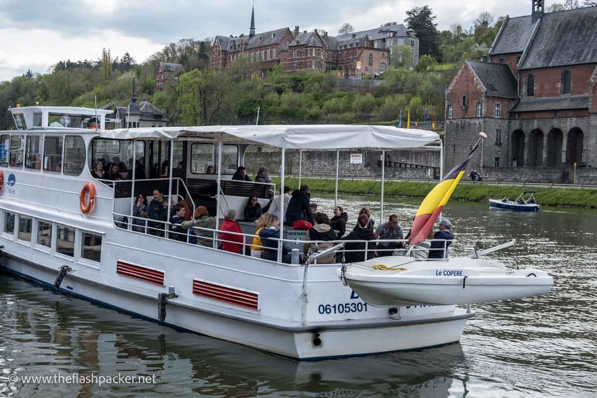 passengers on boat on river meuse in dinant belgium