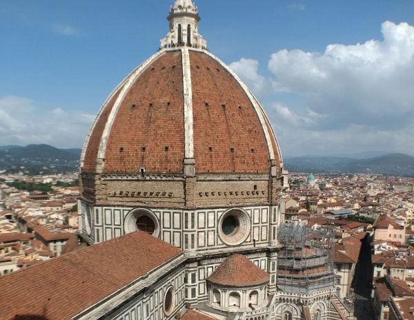 red dome of florence cathedral with red roofs of city below