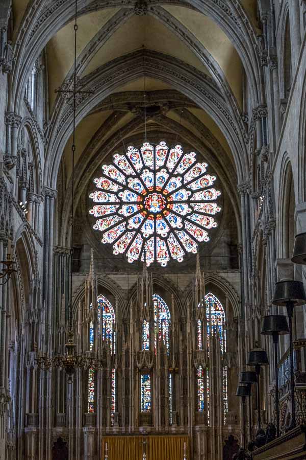 gothic interior of durham cathedral with larke rose window