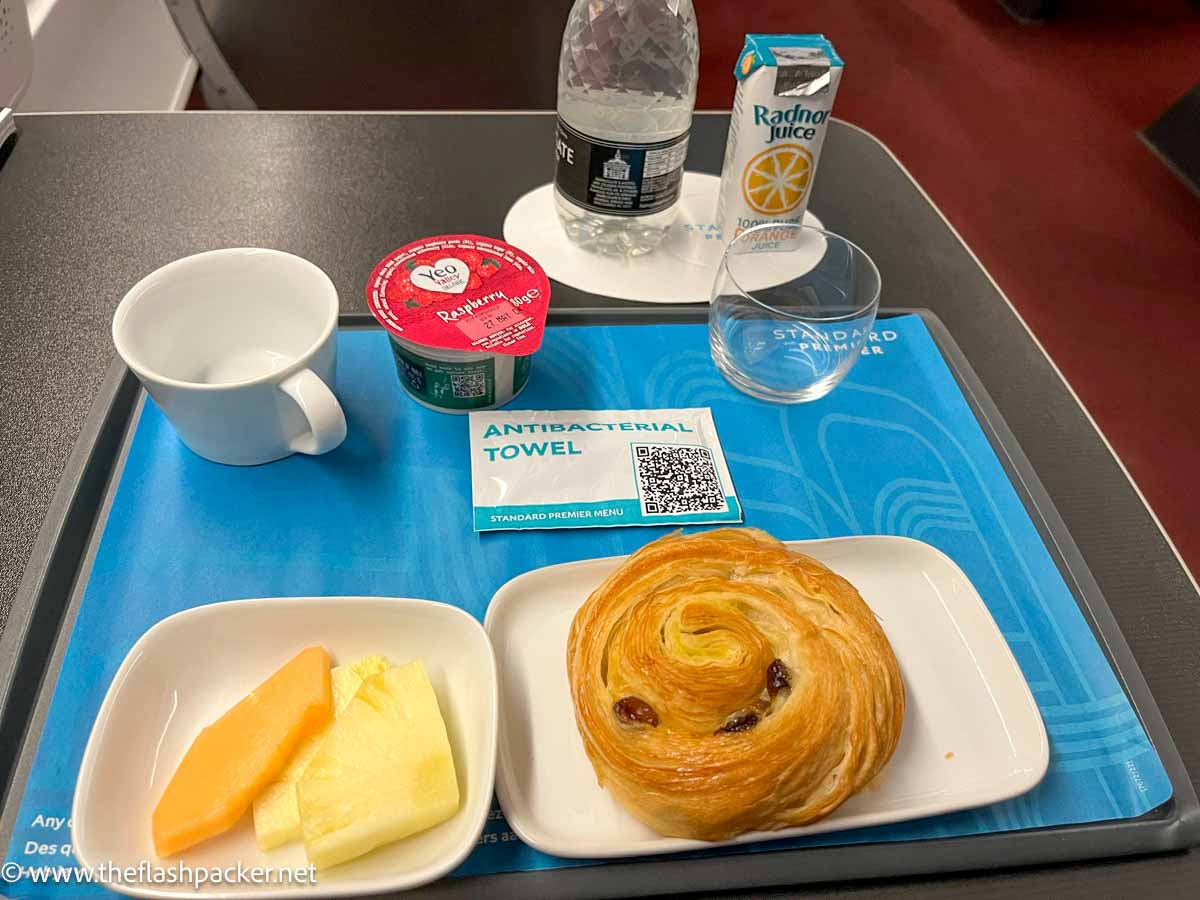 tray with pastry, fruit, yoghurt and orange juice on eurostar standard premier train