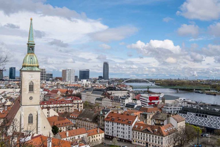 panoramic view of bratislava with cathedral clock tower in foreground