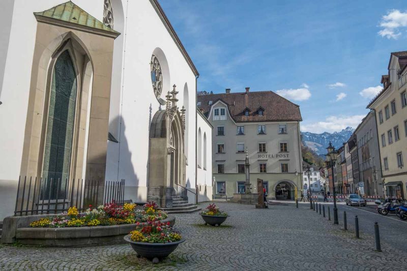 whitewashed exterior of st nicholas cathedral in feldkirch austria