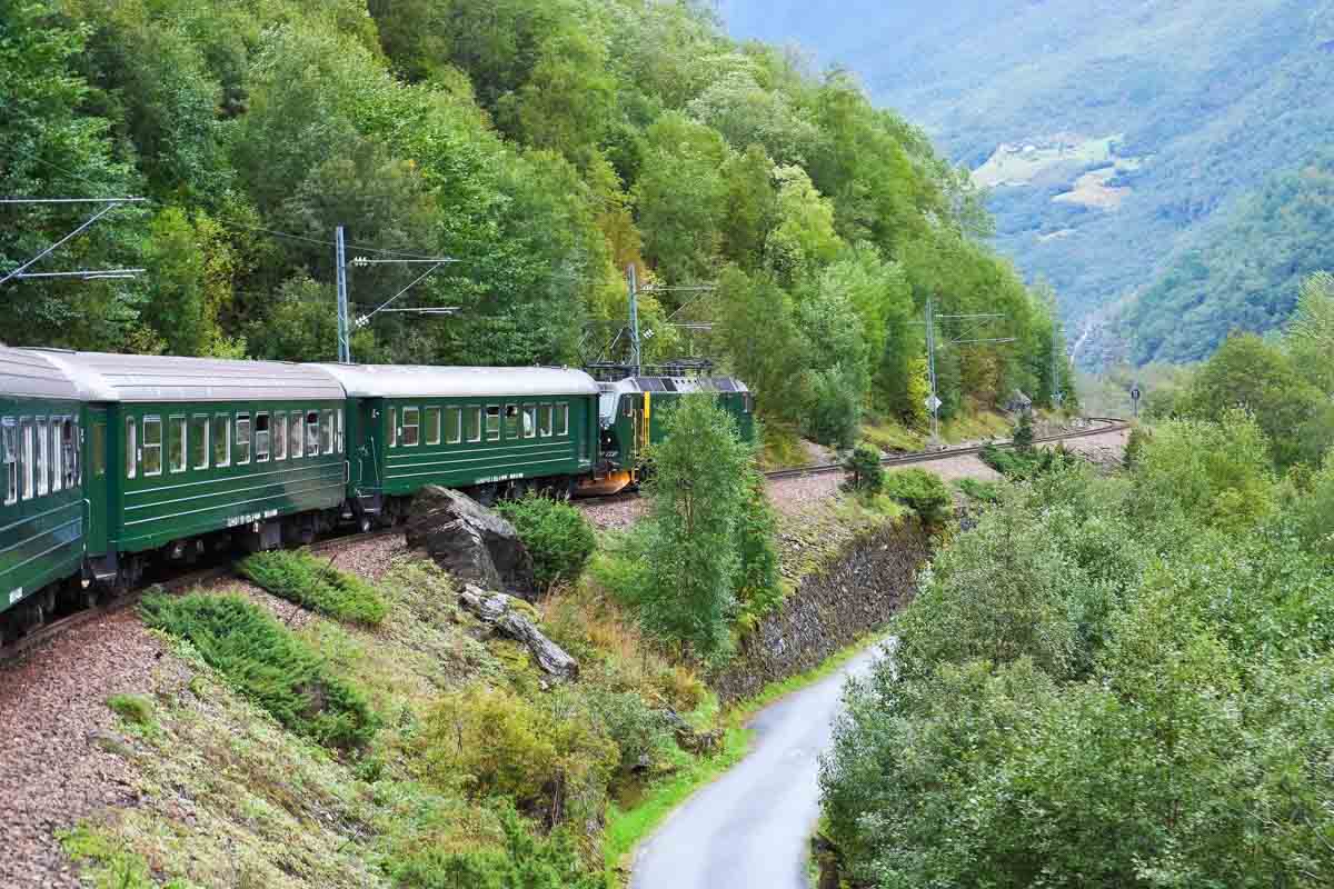 flam railway travelling through valley in norway