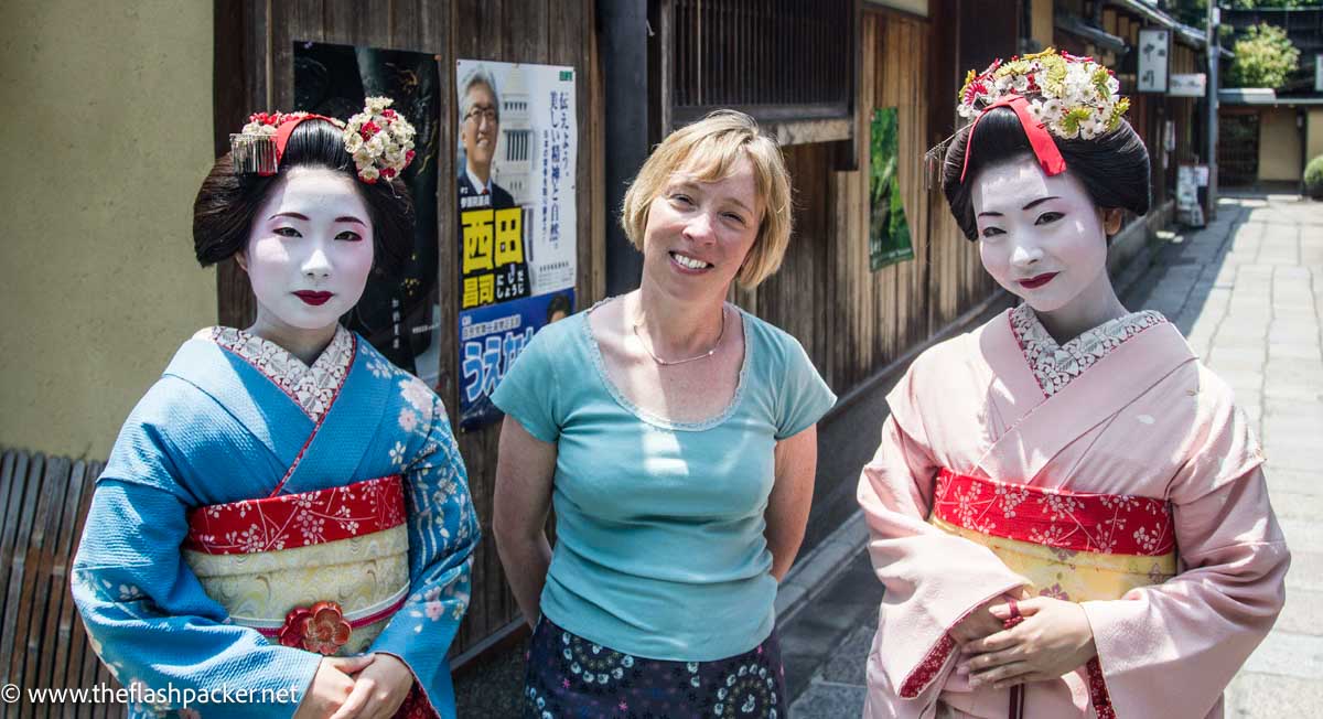 blonde western women with two japanese women dressed as geisha