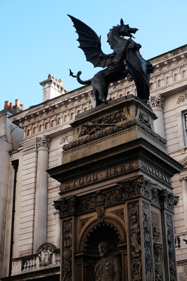 ornate pillar topped by a dragon