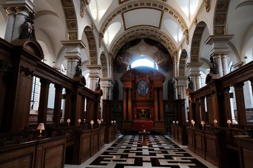 interior of georgian church with tiled floor and wooden pews