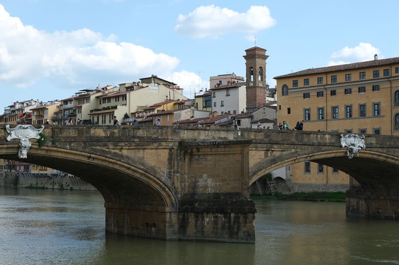 two arcges of stone bridge ponte santa trinita in florence italy