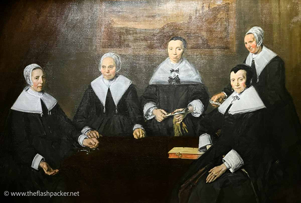 a painting of a group of five 17th century dutch women