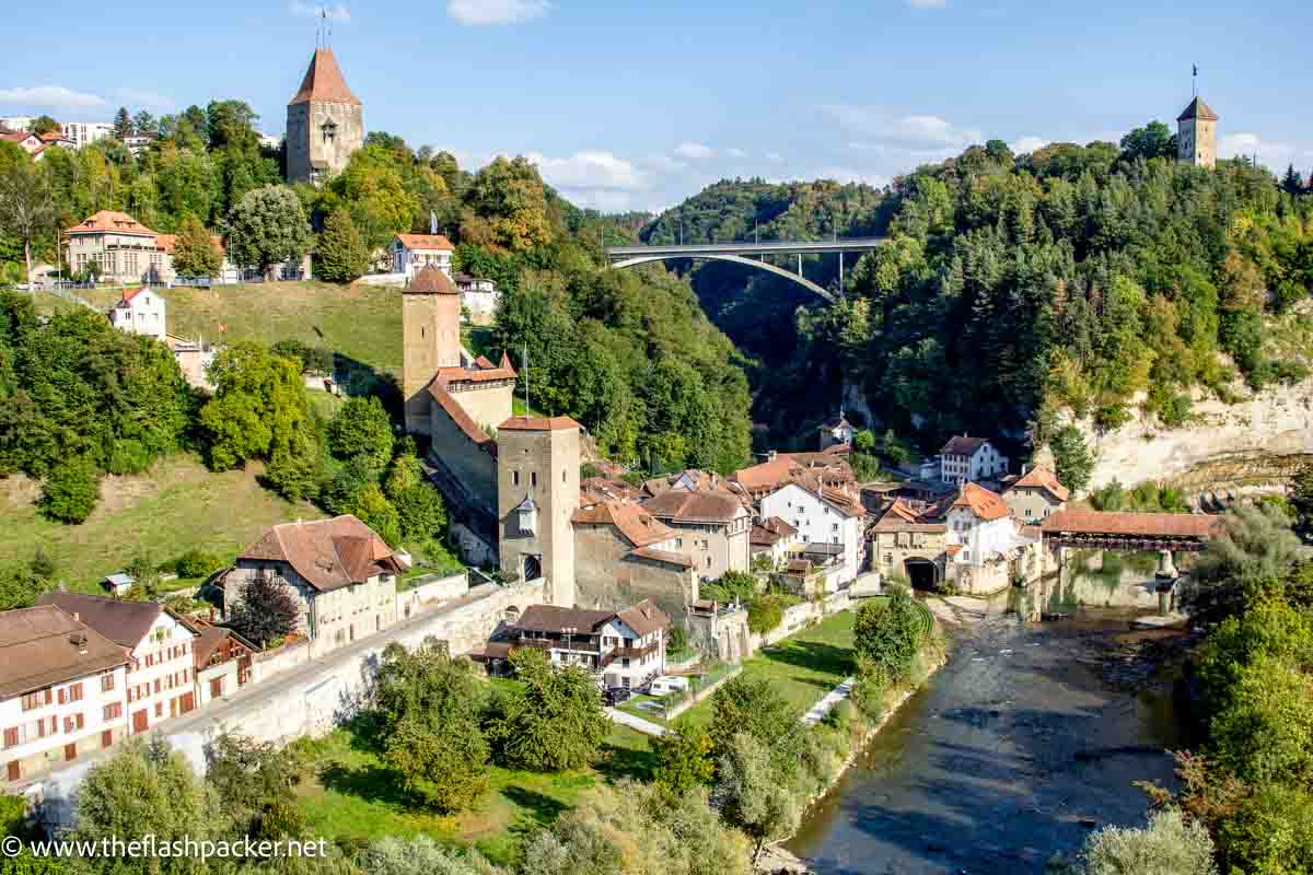 dramatic river gorge lined with buildings including a church