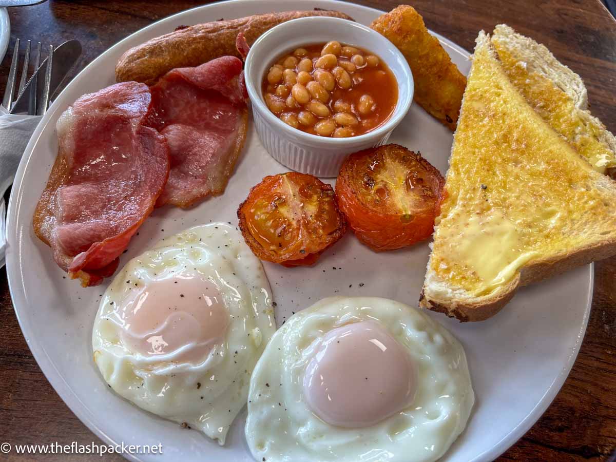 full english breakfast on a white plate