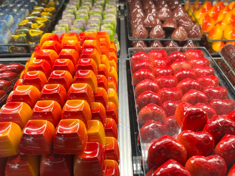 display of brightly coloured chocolates in a case