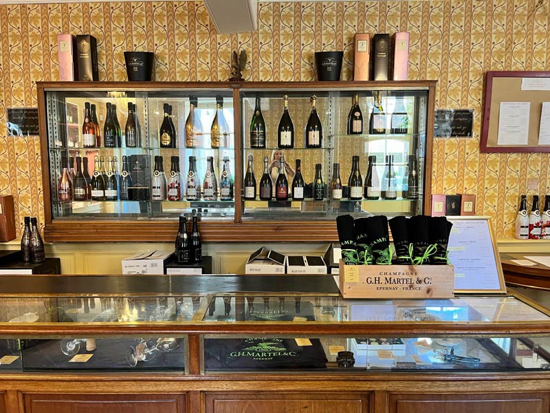 g h martel shop counter selling champagne