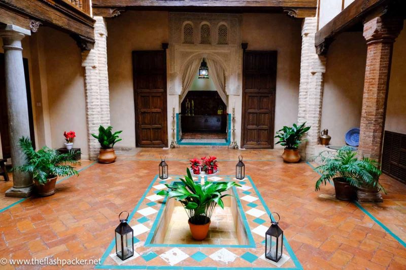 pretty internal courtyard with central well with plant