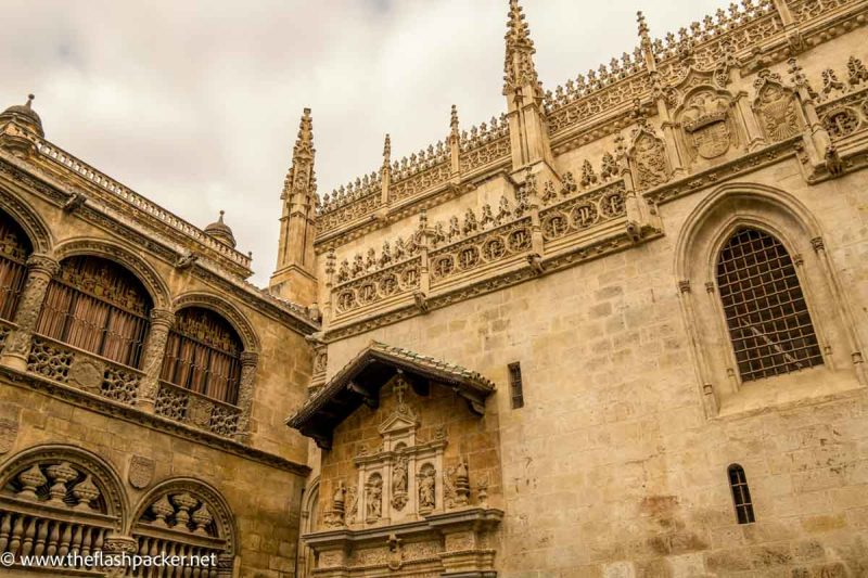 ornate tracery on exterior walls of royal chapel in granada