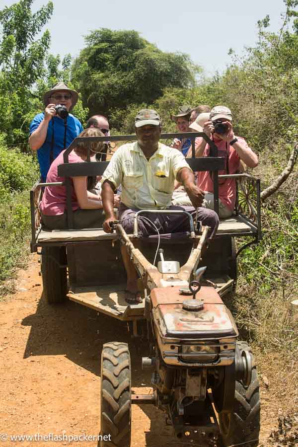 small group of people travelling on a tractor