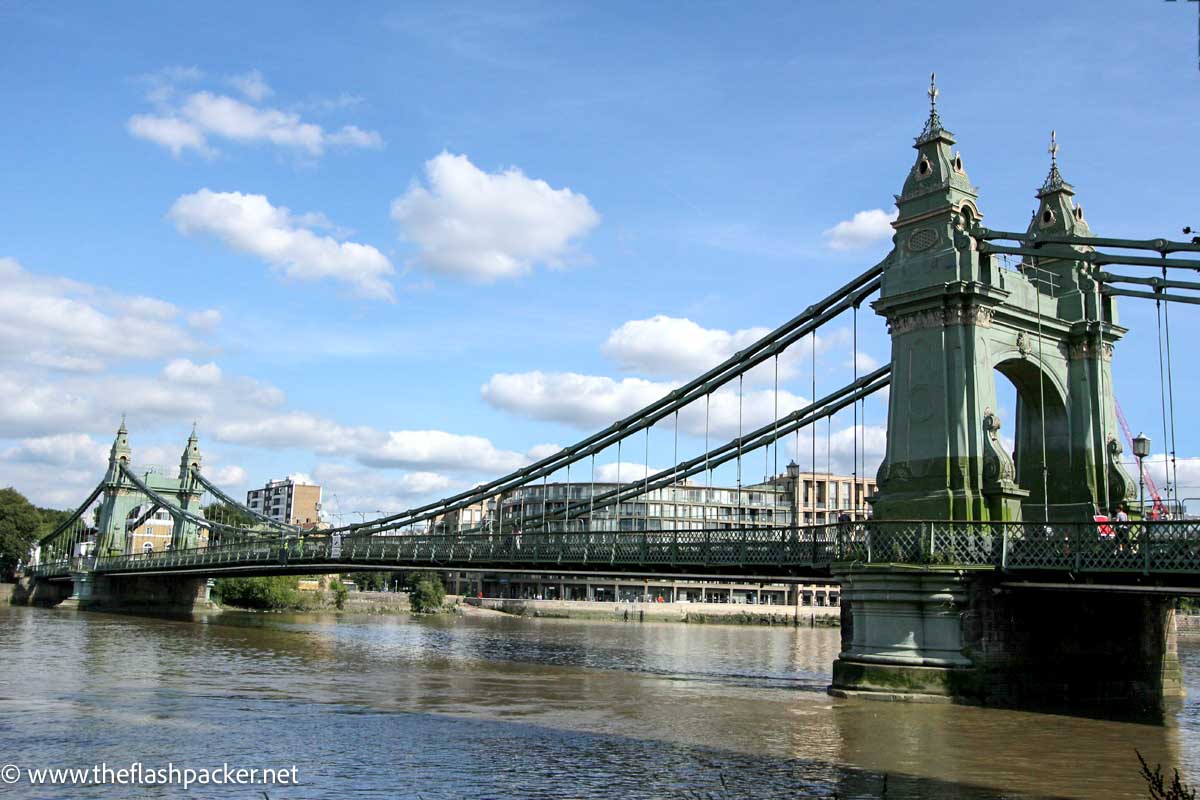 green iron bridge over river